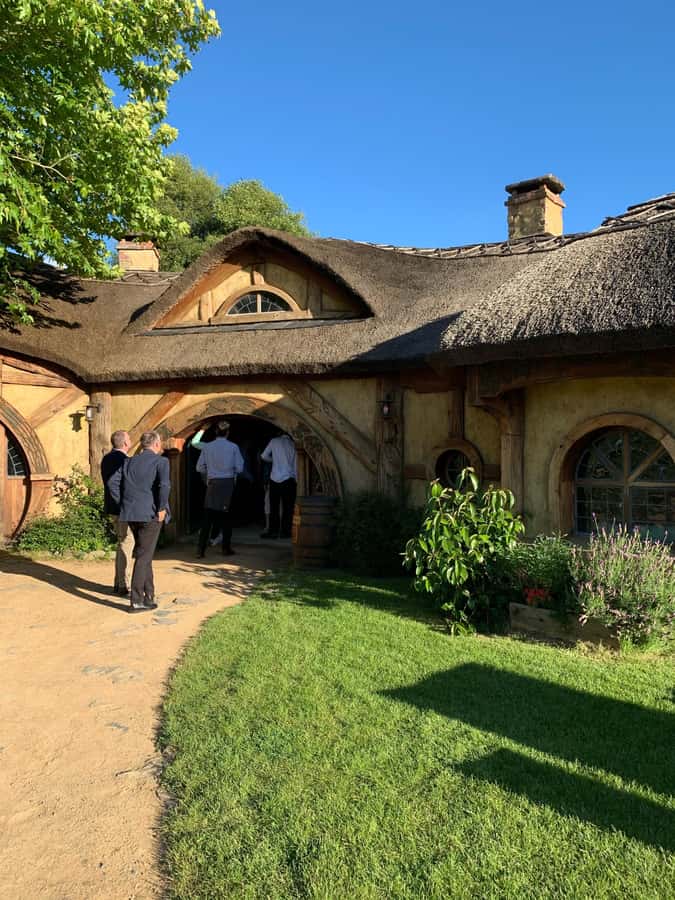 From Auckland: Hobbiton & Hamilton Gardens Small Group Tour - Walking through the 2.5-hour Hobbiton tour