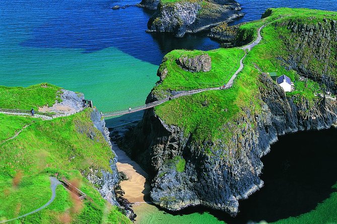 Giant's Causeway Tour including Game of Thrones Sites from Belfast - Dunluce Castle is a cliffside photo stop