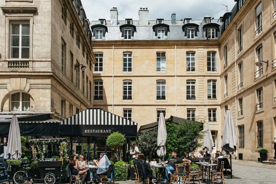 Paris: Emily TV Show Locations Guided Walking Tour - Place de Valois and Emily’s working life